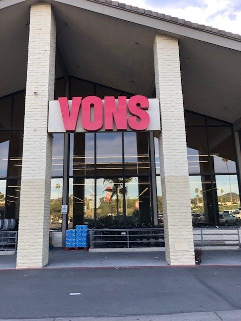 A Vons store with a Vons sign between two pillars.
